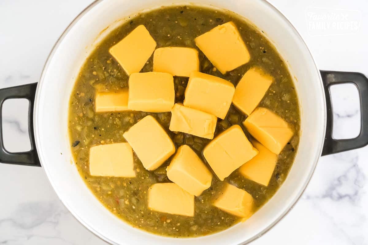 cubes of velveeta melting in salsa verde