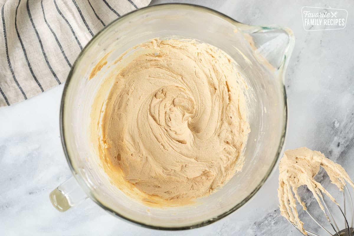Mixing bowl with freshly whipped Peanut Butter Frosting.