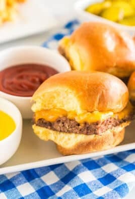 White Castle Sliders on a platter with bowls of ketchup and mustard