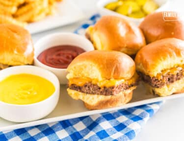 White Castle Sliders on a platter with bowls of ketchup and mustard