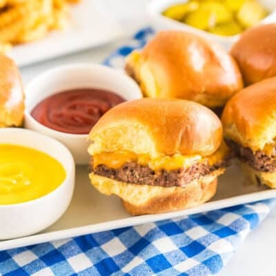 White Castle Sliders on a platter with bowls of ketchup and mustard