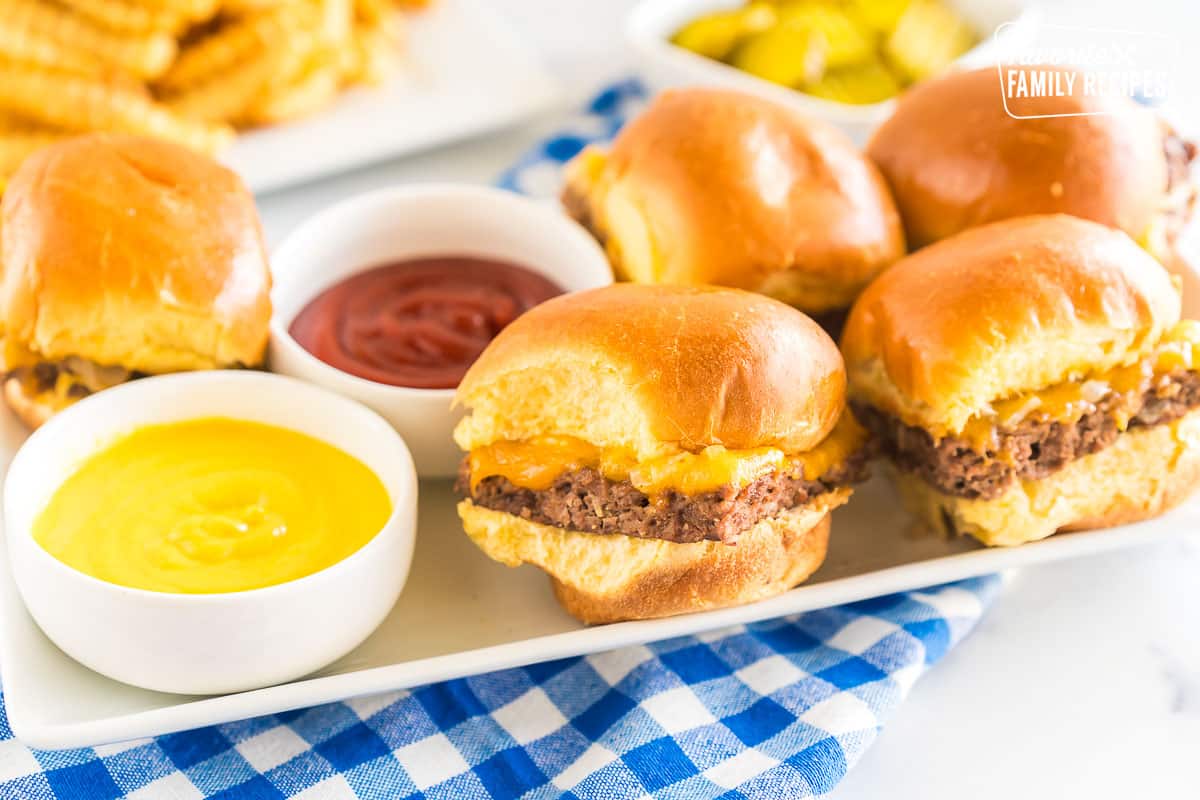 White Castle Sliders on a platter with bowls of ketchup and mustard