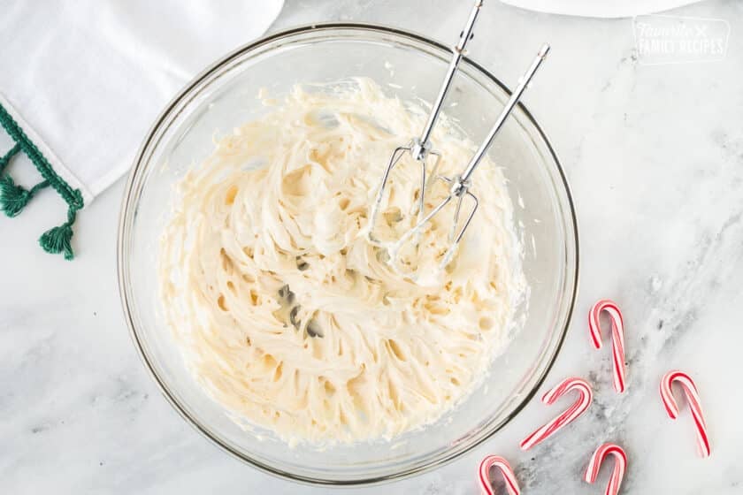 Mixing bowl with whipped cream cheese and butter.