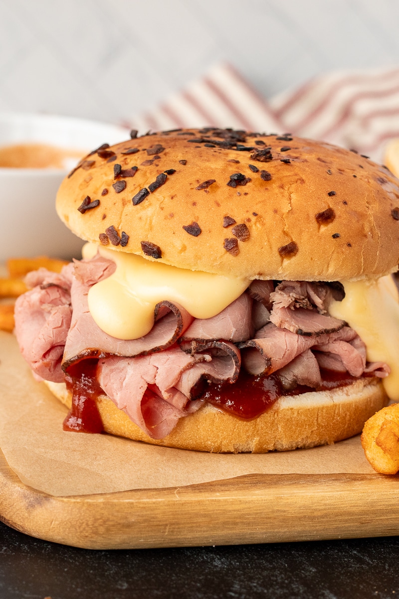 Arby's Beef and Cheddar with creamy cheese sauce and red sauce.