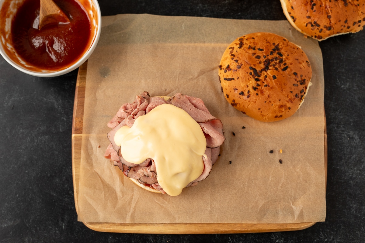 Cheddar cheese sauce poured on top of Arby's roast beef sandwich.