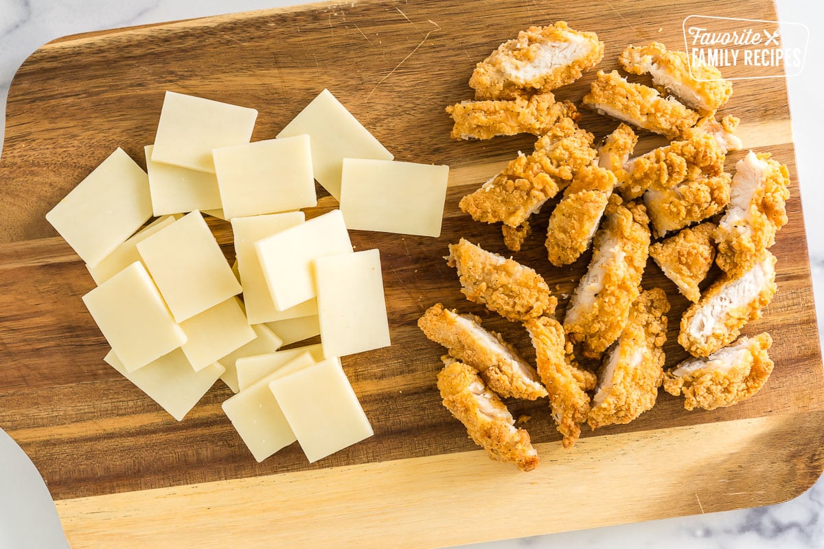 chicken tenders and mozzarella cheese on a cutting board