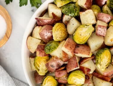 Bowl of Brussels Sprouts and Potatoes roasted with bacon.