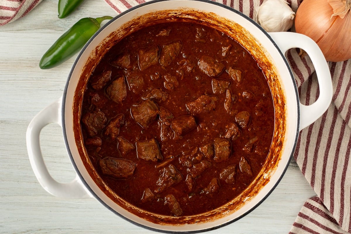 Dutch oven with cooked Texas Chili.