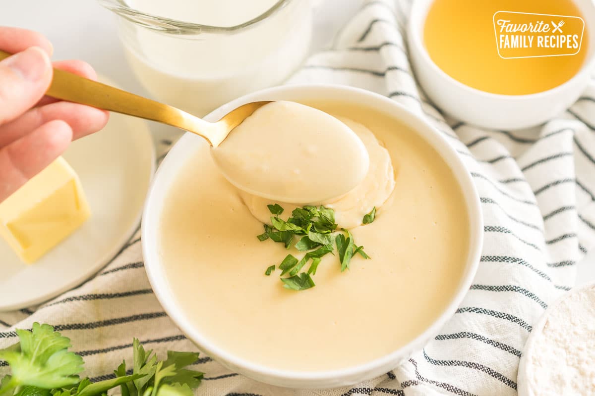 Condensed Cream of Chicken Soup Substitute in a bowl with a spoon taking a spoonful