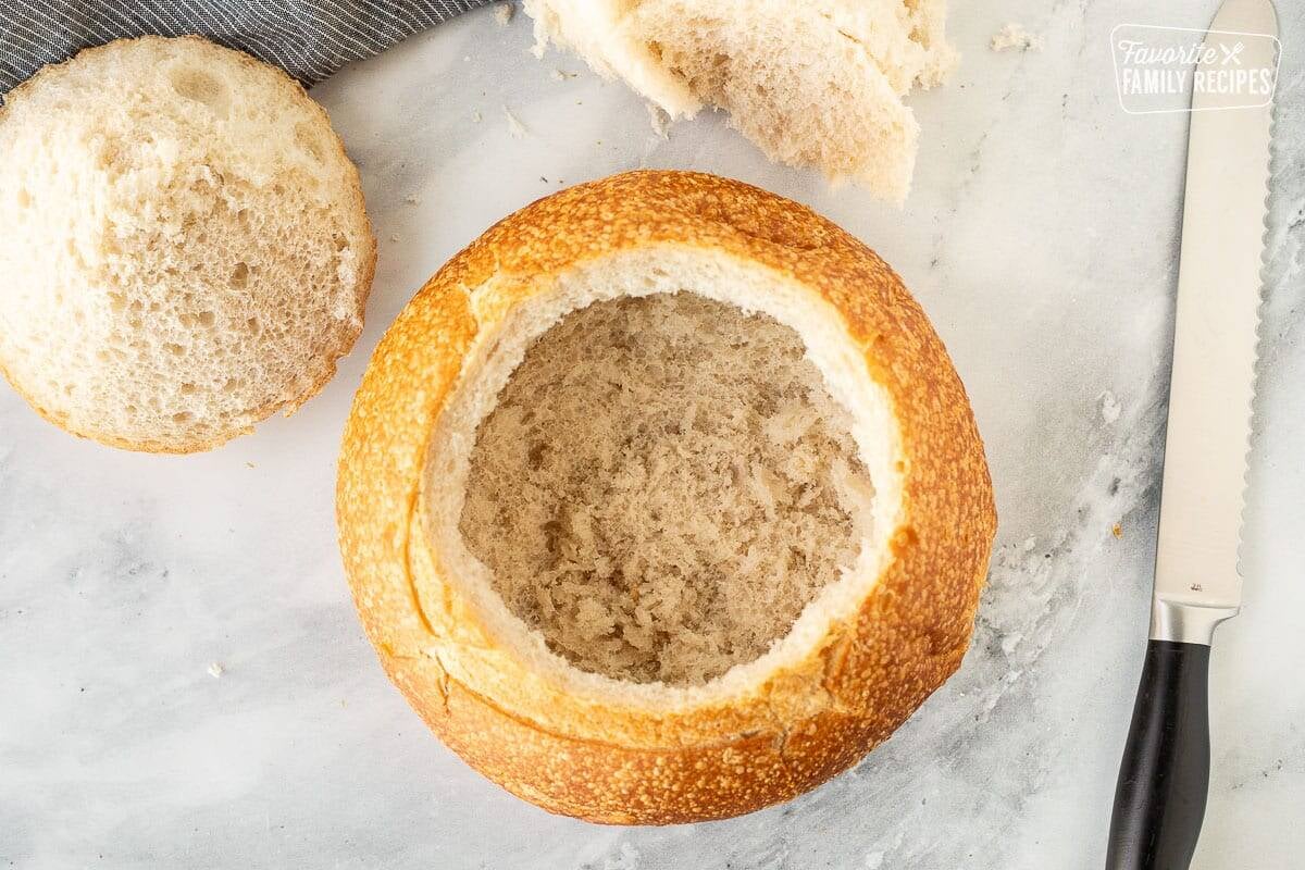 Cut and scooped out bread bowl for Warm Bacon Cheese Dip.