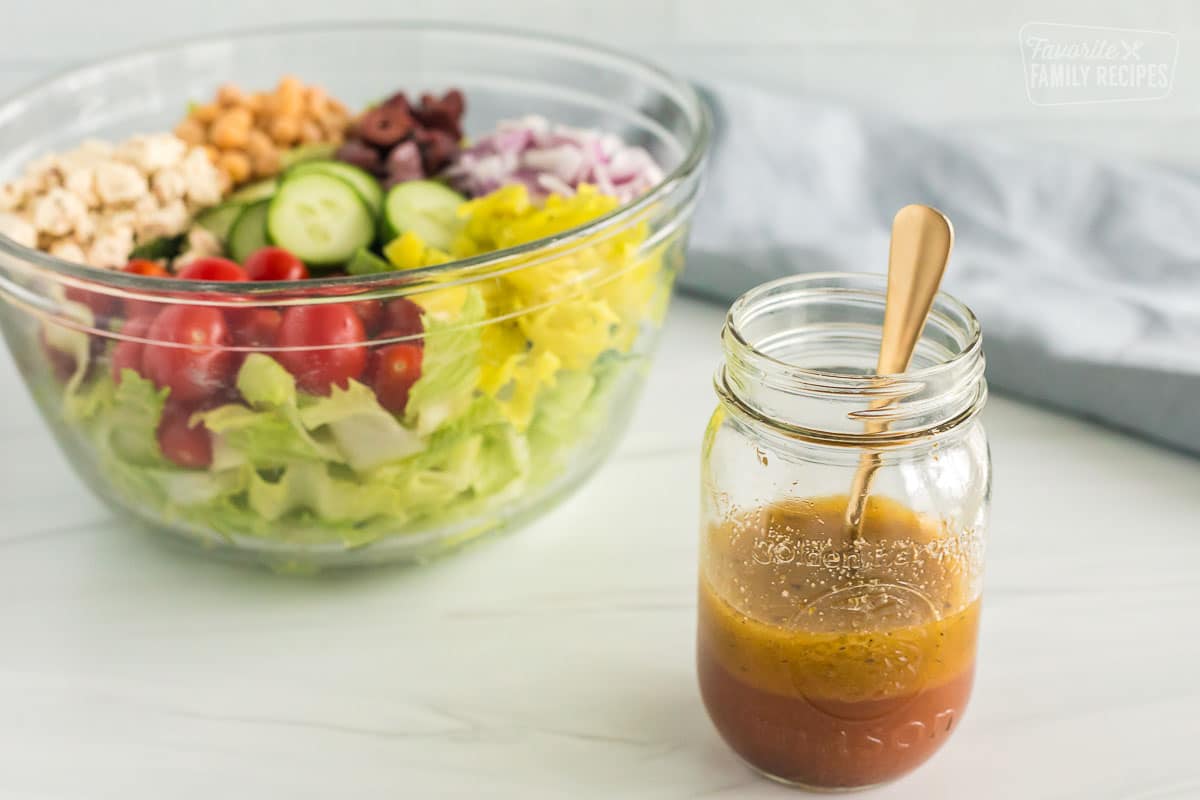 Greek salad and dressing in a jar