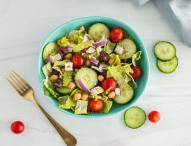 a bowl of greek salad