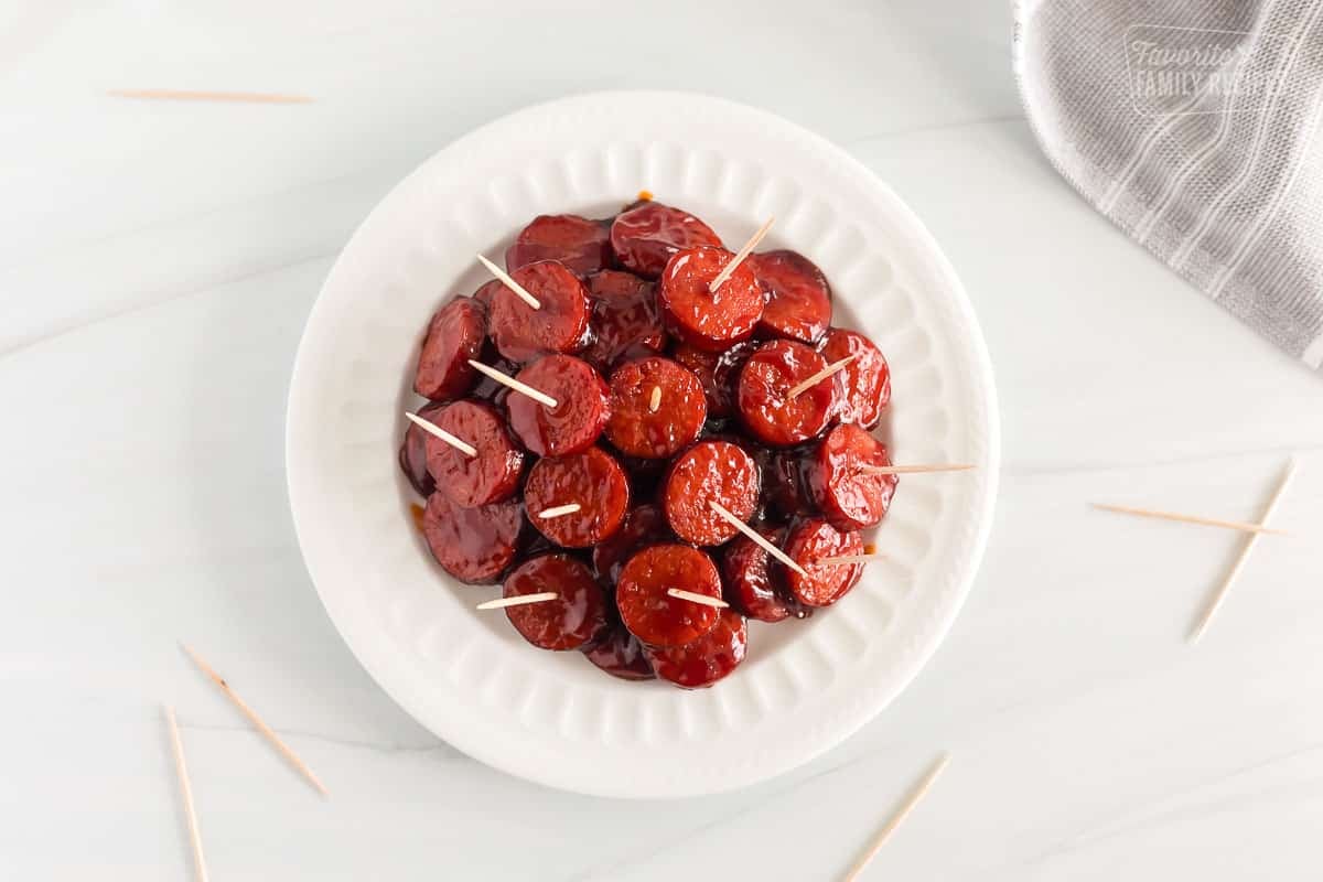 Kielbasa Appetizer on a plate with toothpicks.