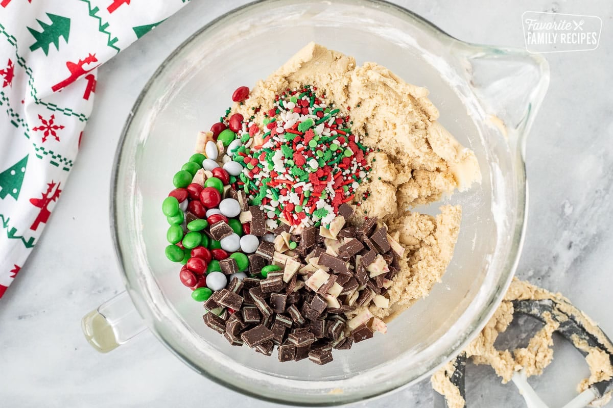 Mixing bowl with dough and candies.