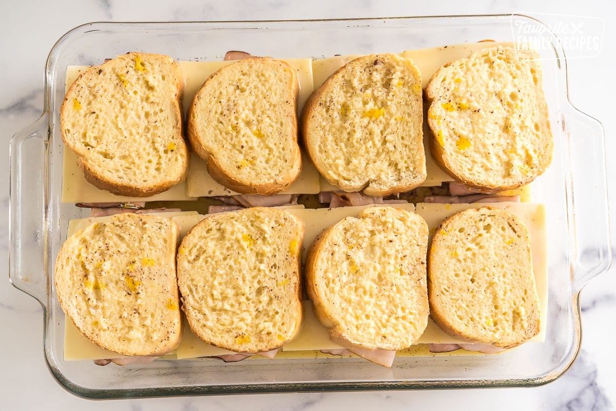 French toast covered with egg mixture in a baking dish