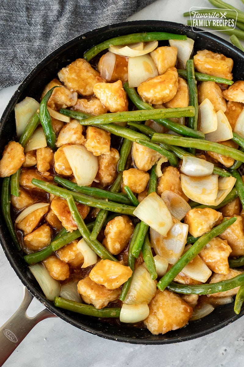 Panda Express String Bean Chicken with ginger sauce in a skillet.