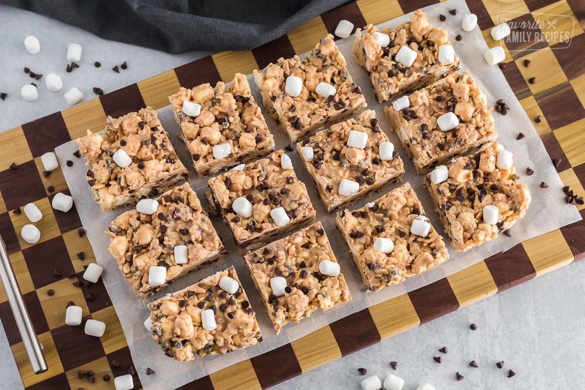 Peanut butter bark cut and laid out on top of parchment paper on a serving platter