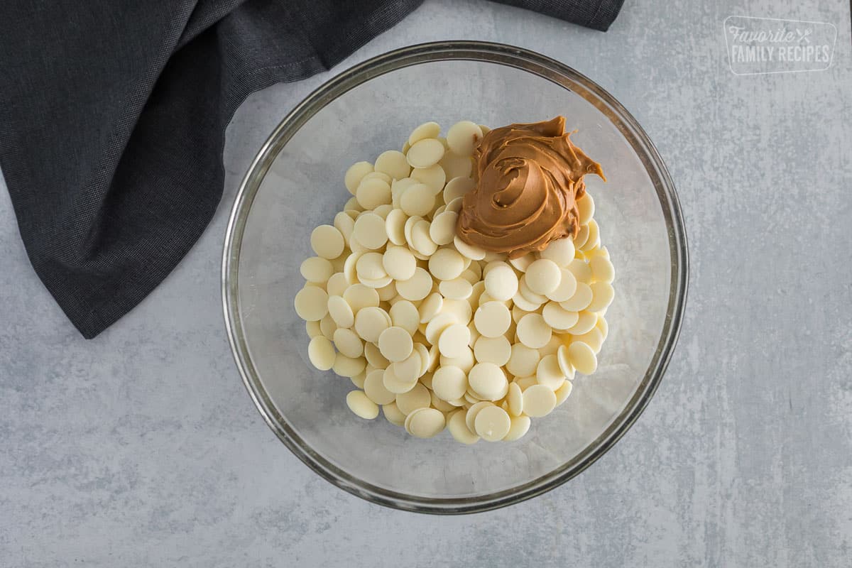 white chocolate melting wafers and peanut butter in a bowl