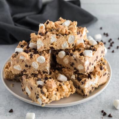 squares of peanut butter bark stacked on top of a plate