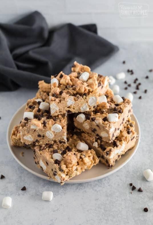 squares of peanut butter bark stacked on top of a plate