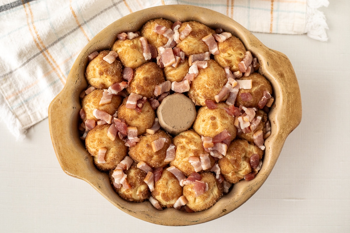 Bundt pan of risen Maple Bacon Monkey Bread.