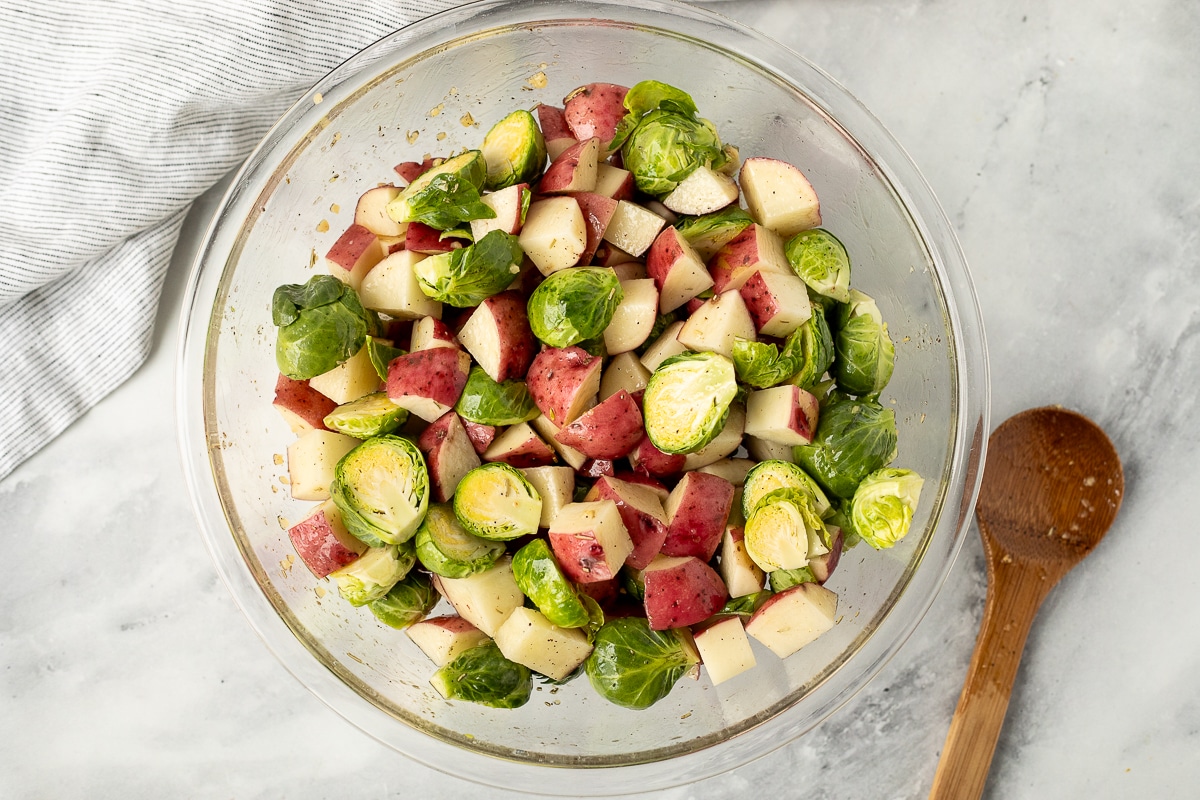 Mixed cut red potatoes and cut Brussels sprouts.