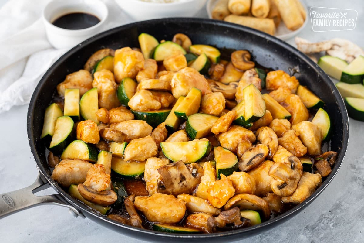 Skillet of Panda Express Mushroom Chicken with zucchini.