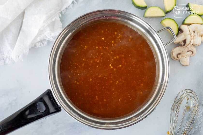 Pan of thickened ginger garlic sauce.