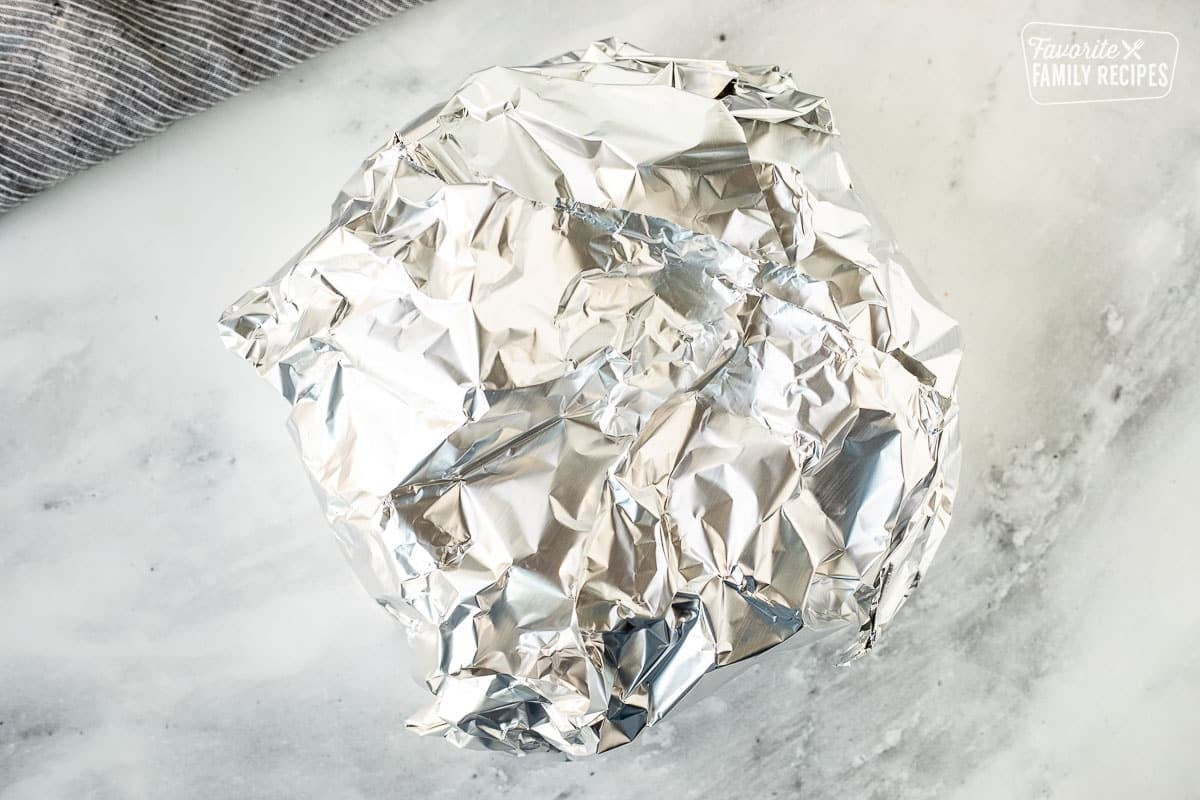 Wrapped bread bowl in aluminum foil.