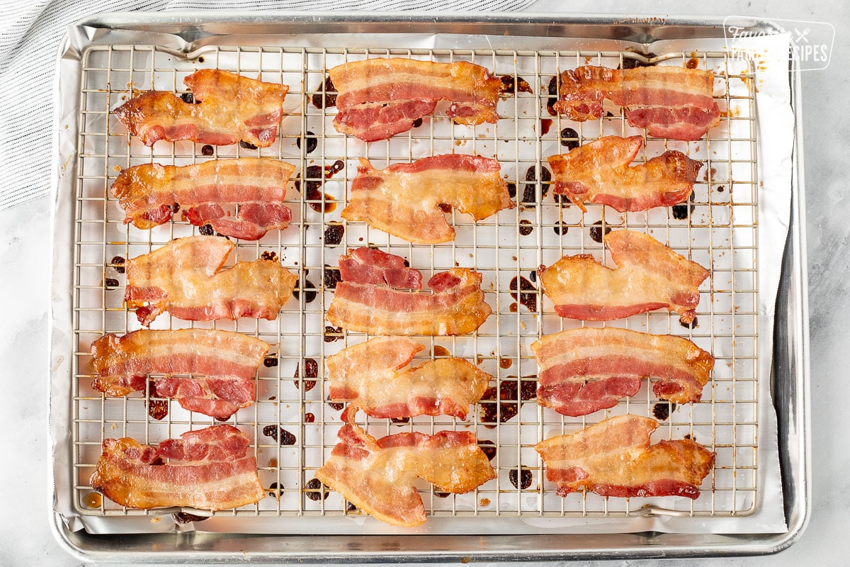 Cooked bacon on a rack.