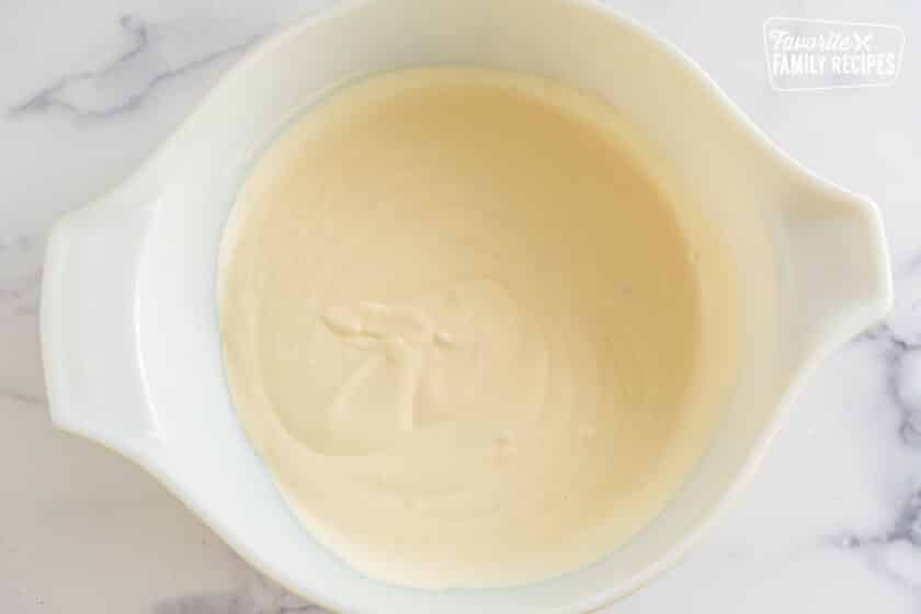 Creamy sauce in a large bowl