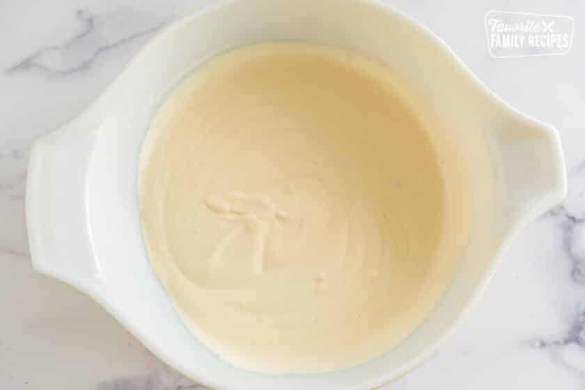 Creamy sauce in a large bowl.