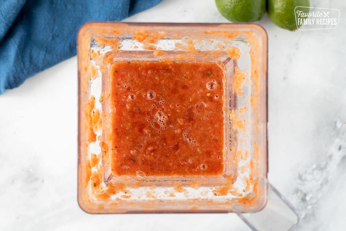 Blender with blended salsa.