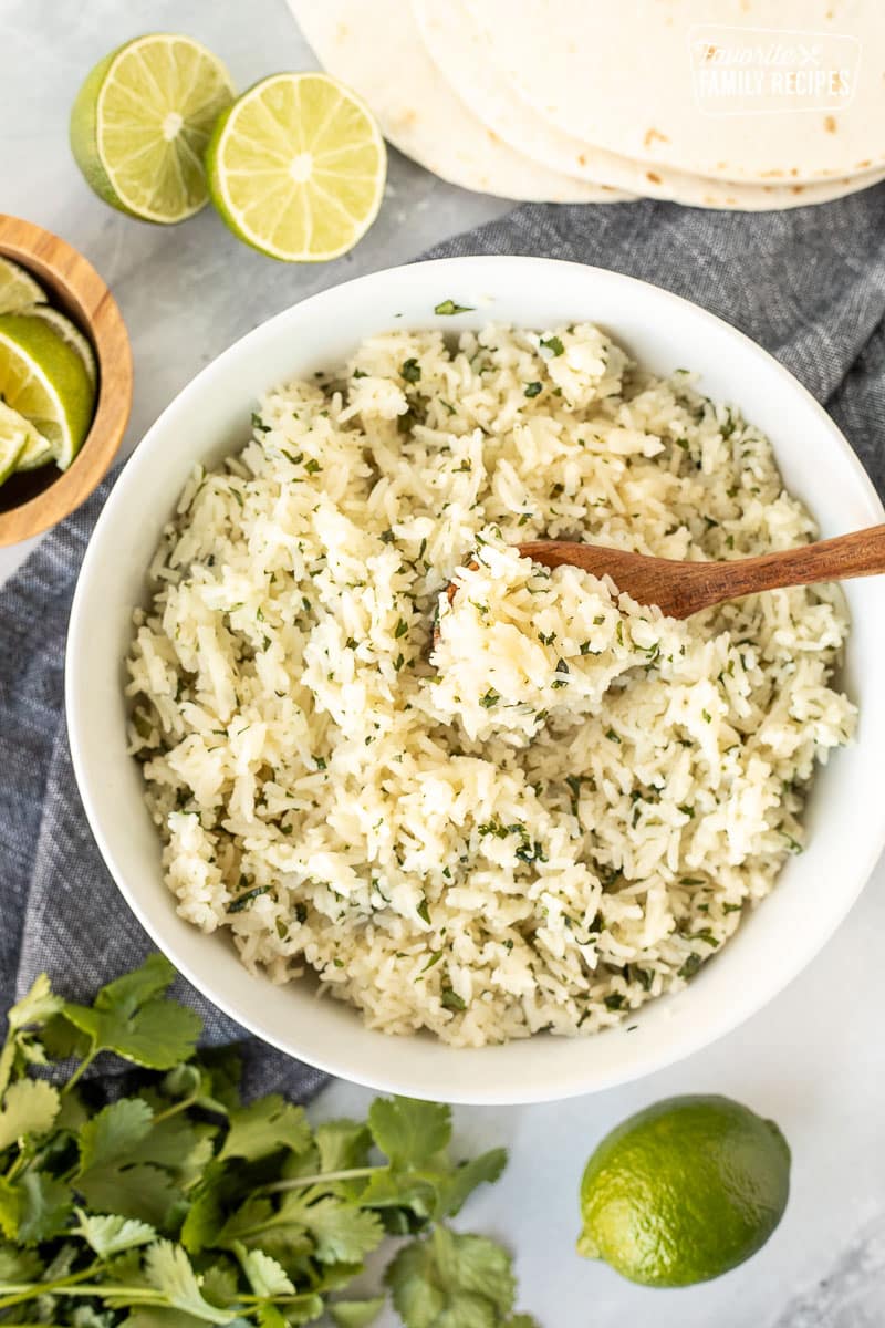 Spoon of Chipotle Rice in a bowl.