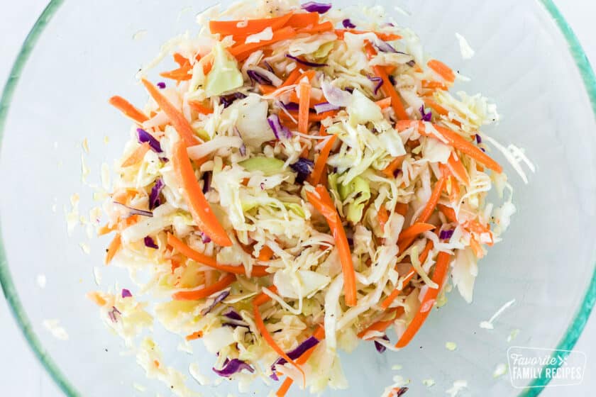 Coleslaw in a clear glass bowl