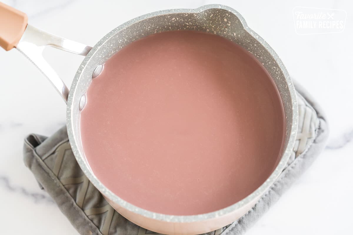 Creamy pink liquid in a pot