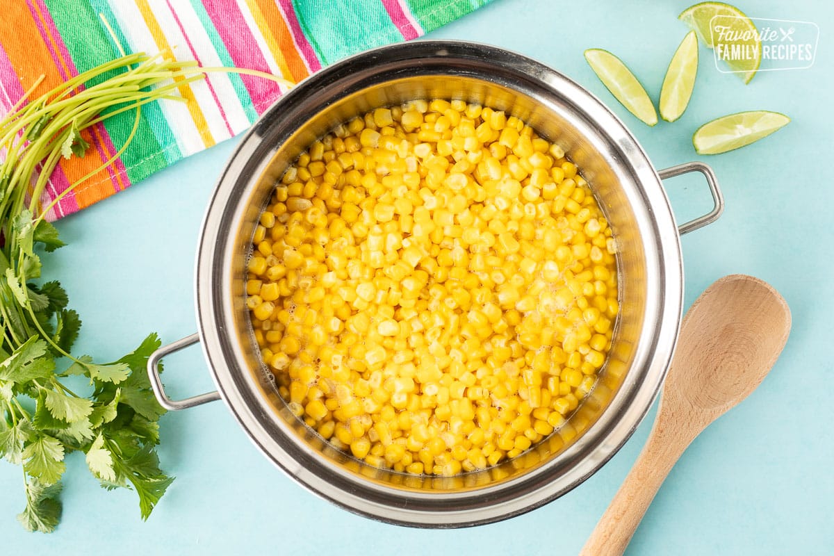Cooked corn in a pot of water.