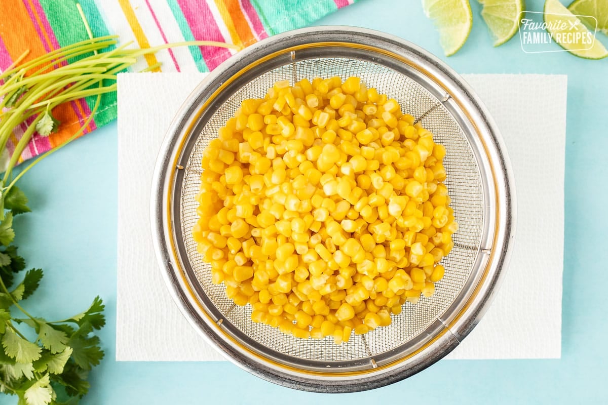 Drained corn in a colander.