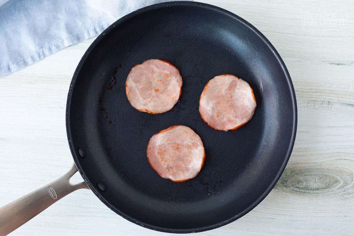 Canadian bacon cooked inside a pan