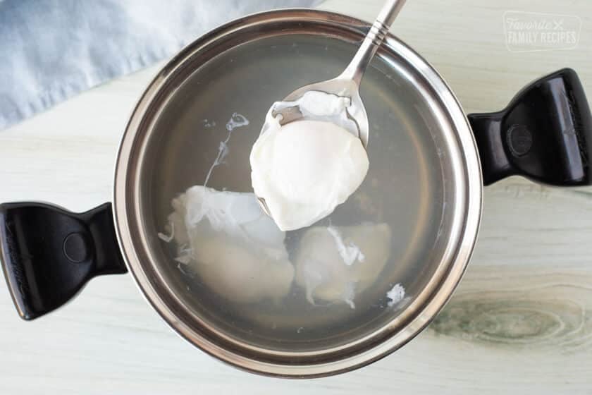 Eggs done poaching in a pot