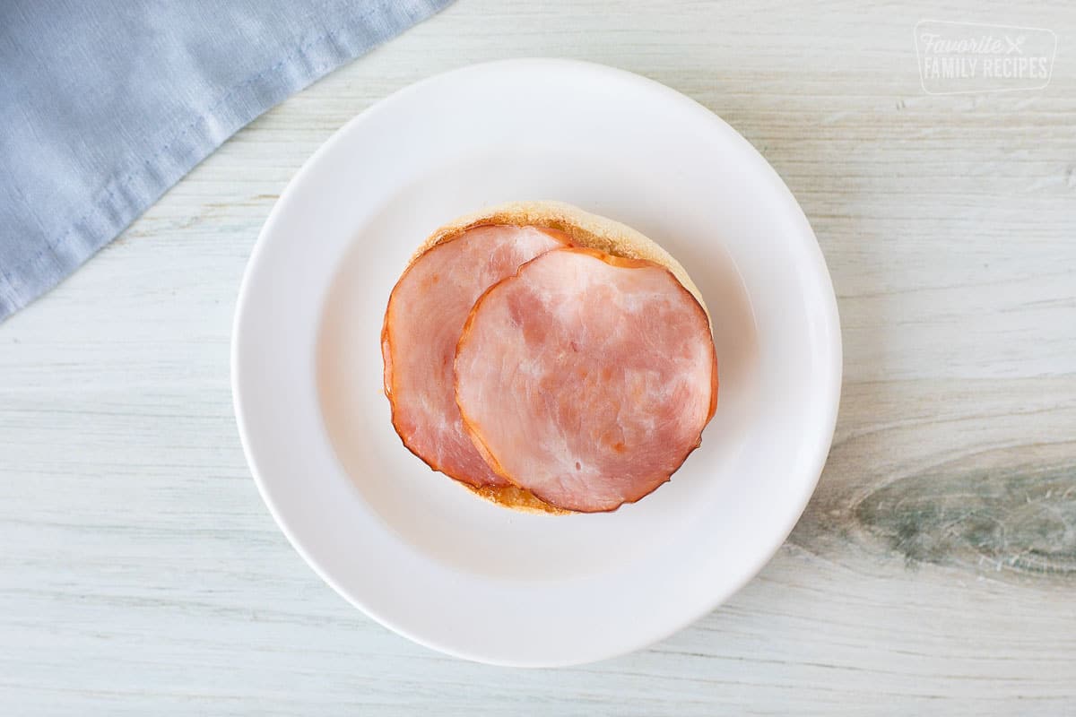 An english muffin with Canadian bacon