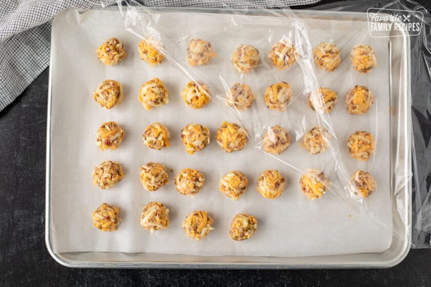 Cookie sheet with thirty two cheese balls for Carthay Circle Fried Biscuits.