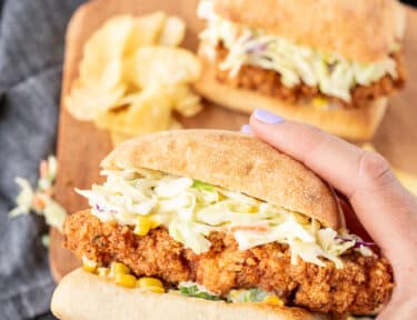 Hand holding a Southern Fried Chicken Sandwich.