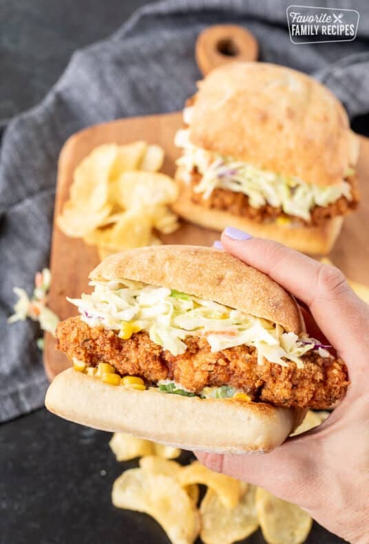 Hand holding a Southern Fried Chicken Sandwich.