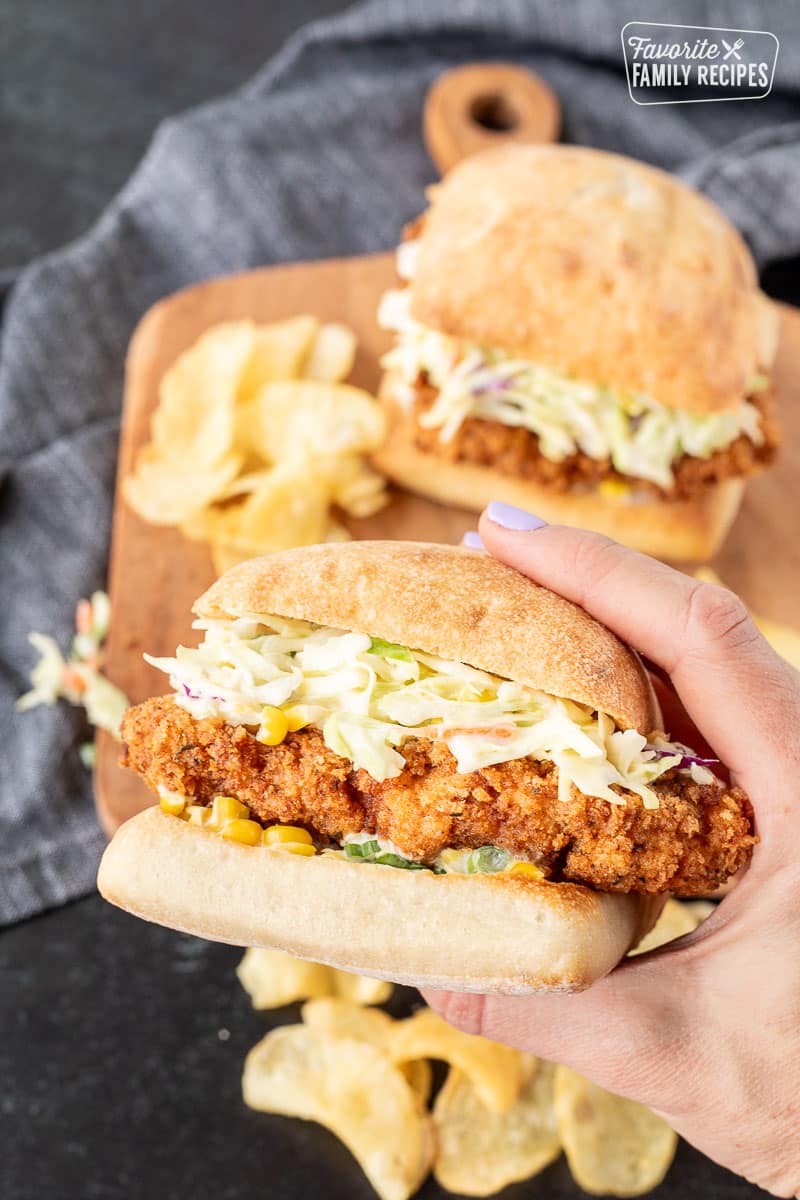 Hand holding a Southern Fried Chicken Sandwich.