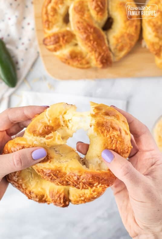 Pulling open a Jalapeno Cheese Stuffed Pretzel.