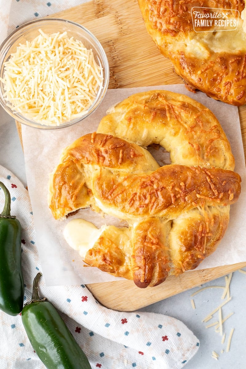 Melted cheese coming out of a Jalapeno Cheese Stuffed Pretzel.