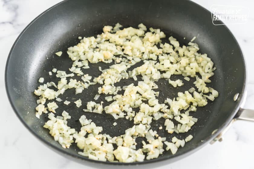 onions and garlic sautéing in a pan