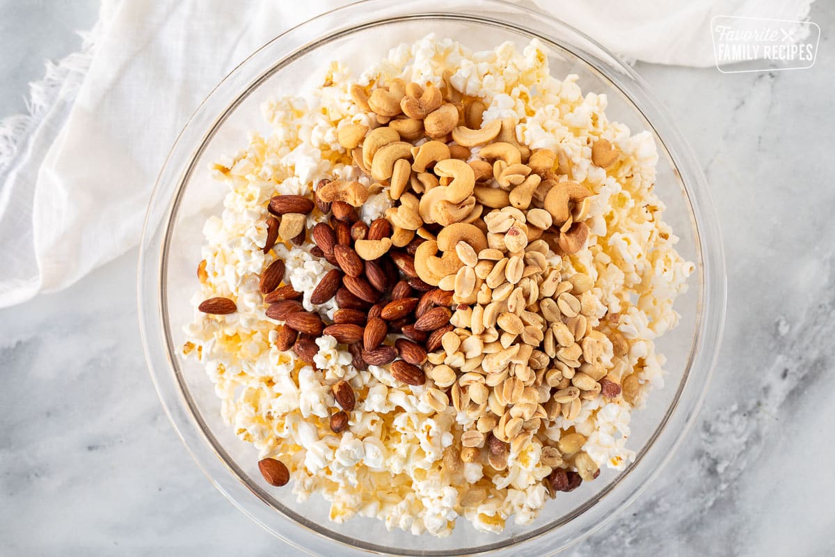 Large bowl with popcorn, cashews, almonds and peanuts.