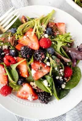 Plate with Nuts About Berries Salad and a fork.